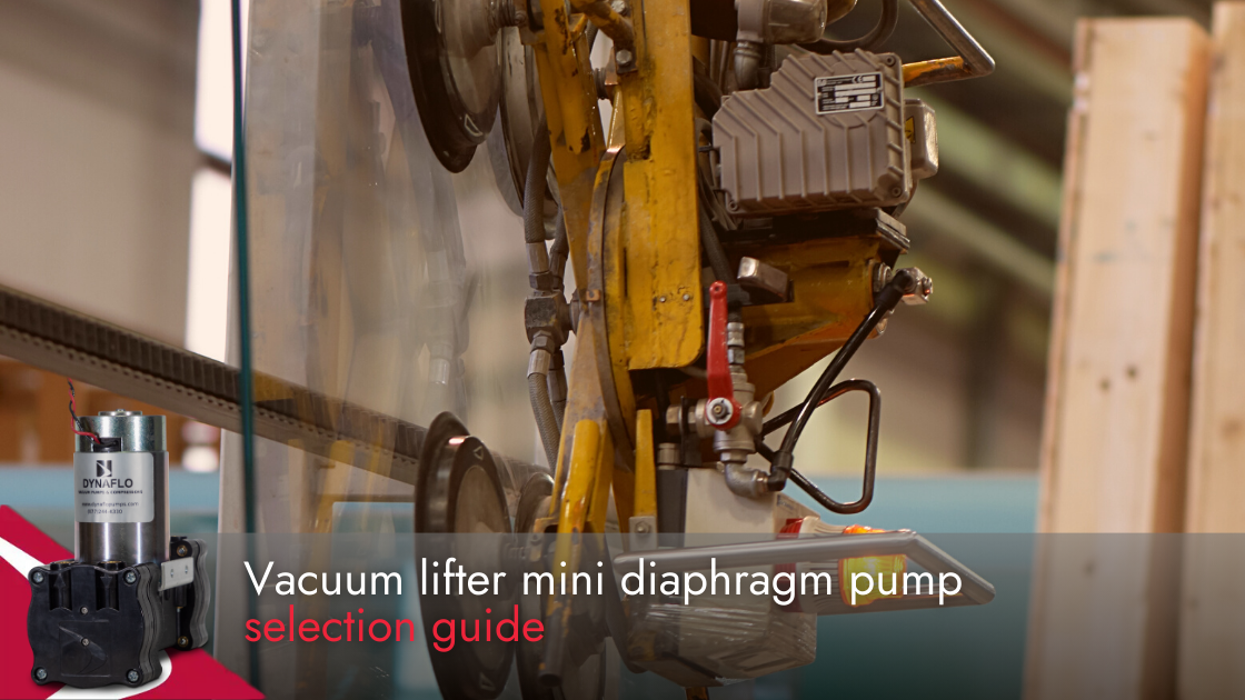 Yellow vacuum lifter placing glass. Dynaflo mini diaphragm pump in the corner.